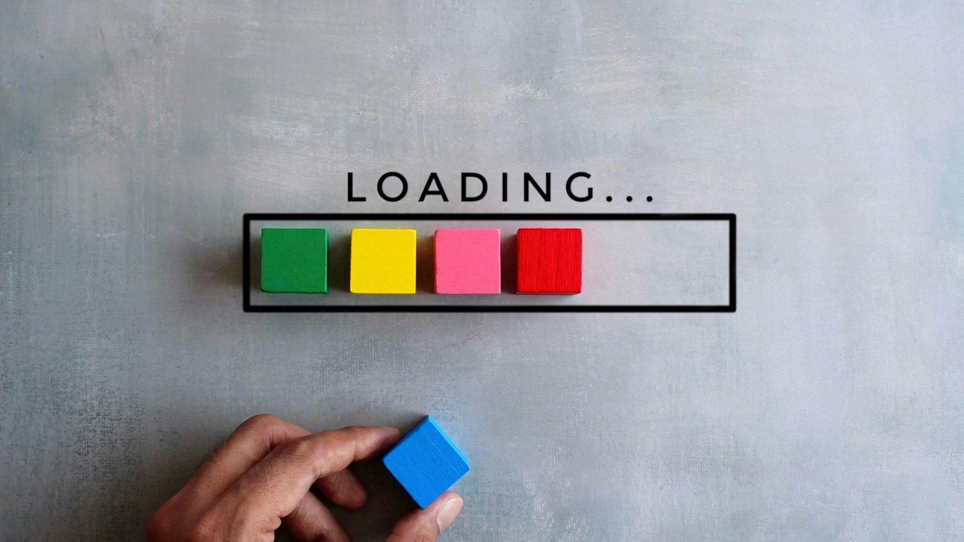 Top view image of loading bar with colorful wooden blocks on concrete floor.